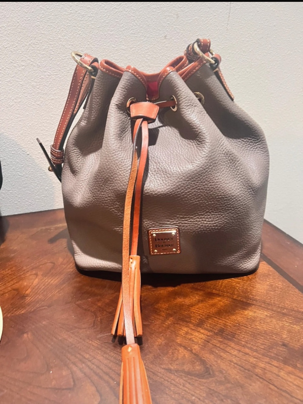 Dooney & Bourke Pebble Bucket Bag with Tan Trim and Tassel